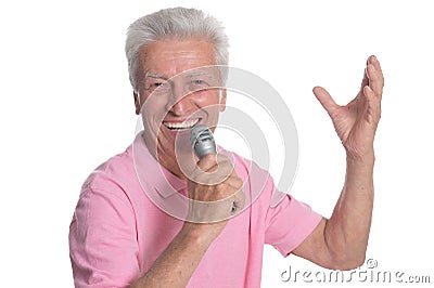 Senior man singing karaoke Stock Photo