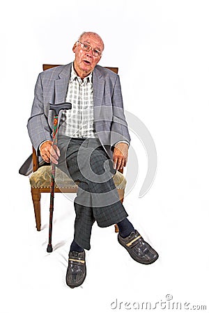 senior man sitting in his armchair Stock Photo