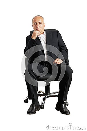 Senior man sitting on office chair Stock Photo