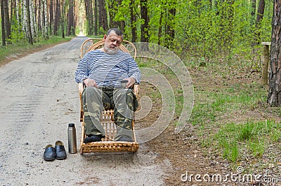 Senior man sleeping rest in forest Stock Photo