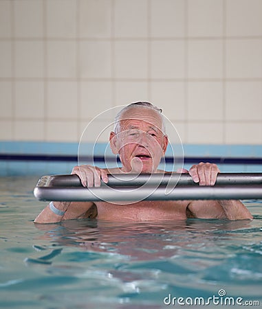 Senior man in swimming pool Stock Photo