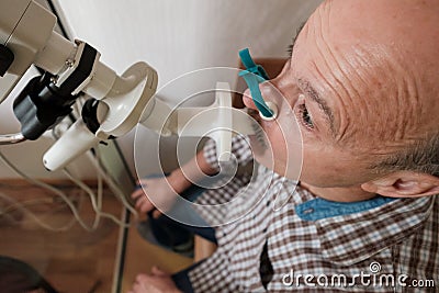 Senior man testing breathing function by spirometry Stock Photo