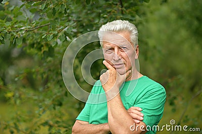 Senior man thinking outddor Stock Photo