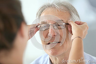 Senior man trying on new eyeglasses Stock Photo