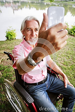 Senior Man In Wheelchair Stock Photo