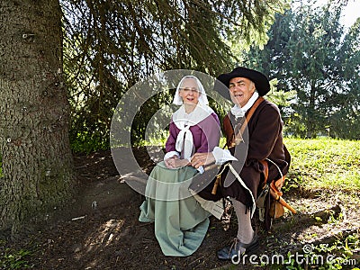Senior man and woman dressed as characters from the 17th Century French regime in New France Editorial Stock Photo