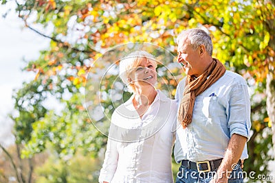 Senior man and woman embracing each other in love Stock Photo