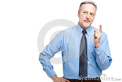 Senior manager pointing his finger up Stock Photo