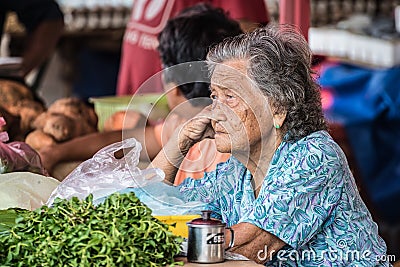 Senior market vendor in Kuching, Malaysian Borneo Editorial Stock Photo