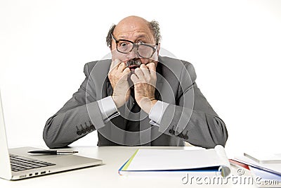 Mature business man with bald head on his 60s working stressed and frustrated at office computer laptop desk looking desperate Stock Photo