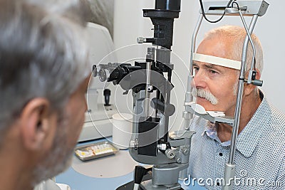 Senior man checking vision with ophtalmologist Stock Photo