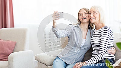 Senior mom and her daughter doing selfie Stock Photo