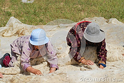 Senior Mongolian women produce felt in Harhorin, Mongolia. Editorial Stock Photo