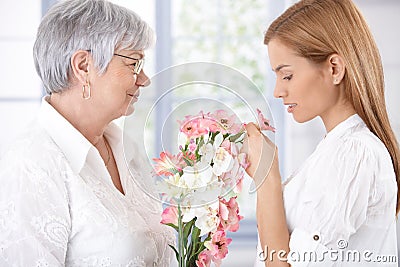 Senior mother and daughter with flowers Stock Photo