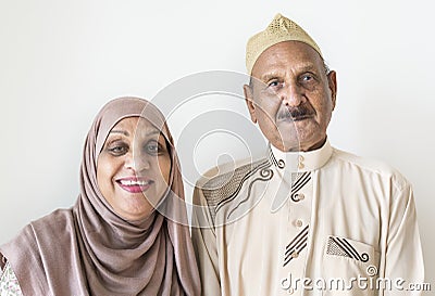 Senior Muslim couple in traditional dress at home Stock Photo