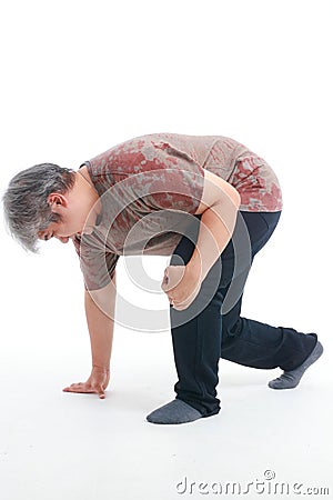 Senior obese man has left knee pain. Stock Photo