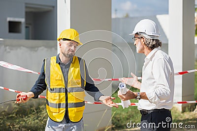 Senior officer male argue complain blame to construction engineer foreman for bad construction low quality project fail not pass Stock Photo