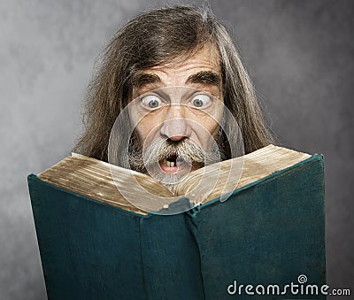 Senior Old Man Read Book, Amazing Face Crazy Shocked Eyes Stock Photo