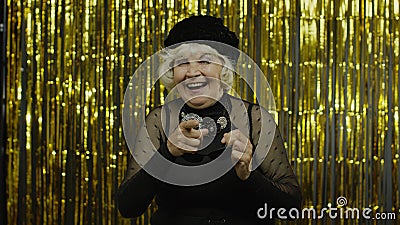 Senior old woman in stylish sunglasses pointing finger to camera, looking happy, choosing person Stock Photo