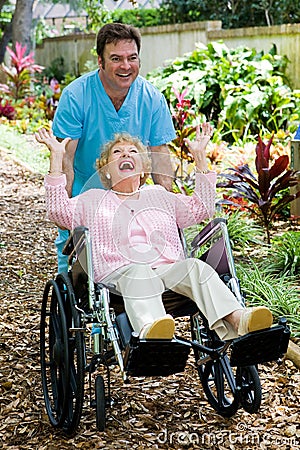 Senior and Orderly Clowning Around Stock Photo