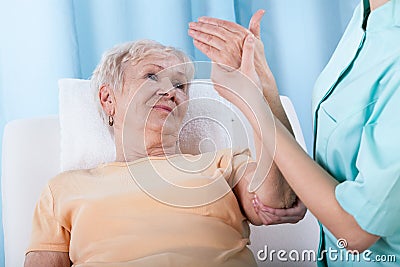Senior with painful arm Stock Photo