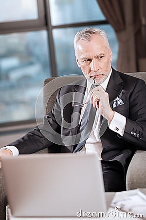 Senior pensive man taking decision Stock Photo
