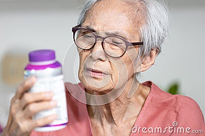Senior people with very small fonts on product,difficult to read,unable to see,especially for the elderly,communication of Stock Photo