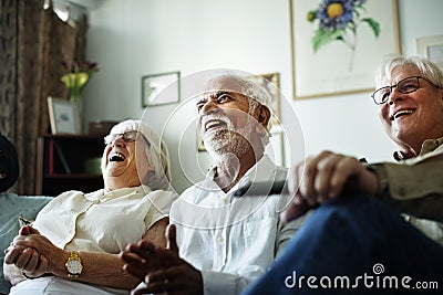 Senior people watching comedy show together Stock Photo