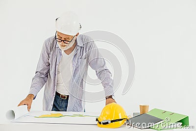 Senior professional architecture building engineer looking at blueprint floor plan serious working Stock Photo