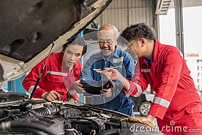 Senior professional car mechanic use obd2 car diagnostics device scanner to interpreting the automotive error codes Stock Photo