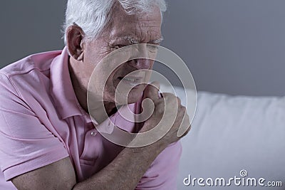 Senior with shoulder pain Stock Photo