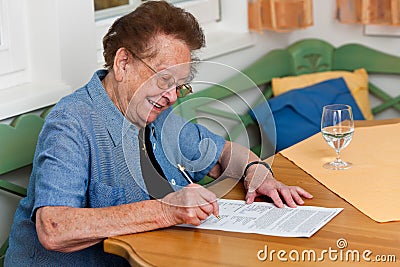 Senior signs a contract Stock Photo