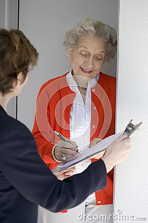 Senior signs a petition Stock Photo