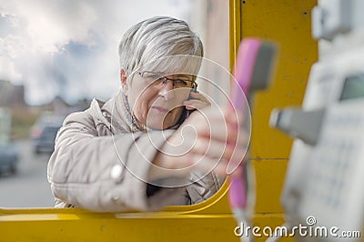 Senior with Smartphone and Handset Stock Photo