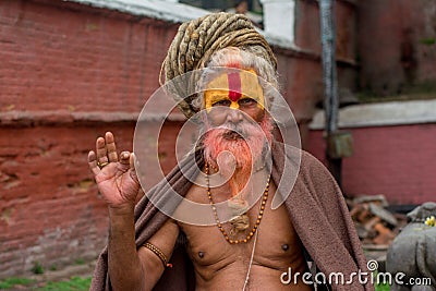 Senior spiritual disciple with dreadlocks at the temple in Kathmandu in Nepal Editorial Stock Photo