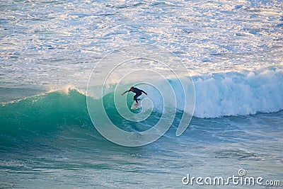 Senior surfer riding a perfect wave. Editorial Stock Photo