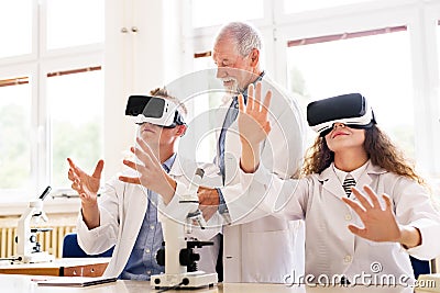 Senior teacher teaching biology to high school students Stock Photo