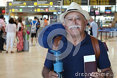 Senior traveler showing his passport Stock Photo
