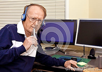 Senior volunteer answering phone calls 4 Stock Photo