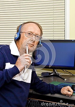 Senior volunteer answering phone calls 7 Stock Photo