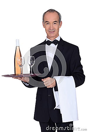 Senior waiter holding tray Stock Photo