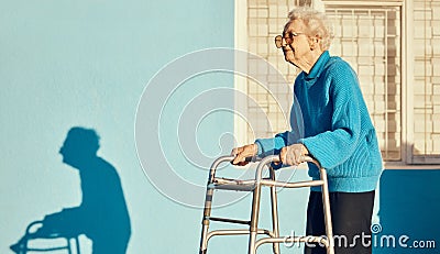 Senior, walker and woman in a city with a disability, osteoporosis or arthritis walking with wall mockup. Relax fitness Stock Photo