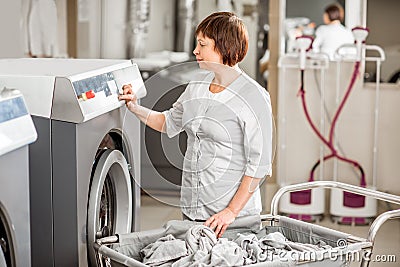 Senior washwoman in the laundry Stock Photo