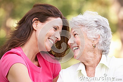 Senior Woman With Adult Daughter In Park Stock Photo
