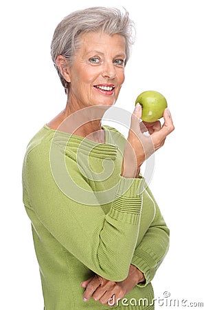 Senior woman with apple Stock Photo