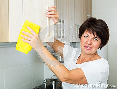 Senior woman cleaning Stock Photo