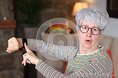 Senior woman complaining about time Stock Photo