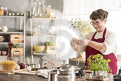 Senior woman cooking Stock Photo