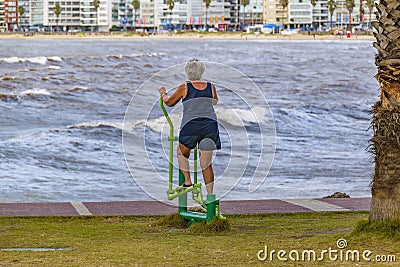 Senior Woman Doing Exercise at Waterfront Park, Montevideo, Uruguay Editorial Stock Photo