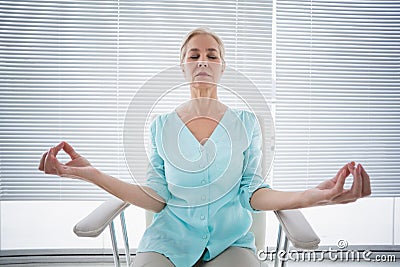 Senior woman doing yoga Stock Photo